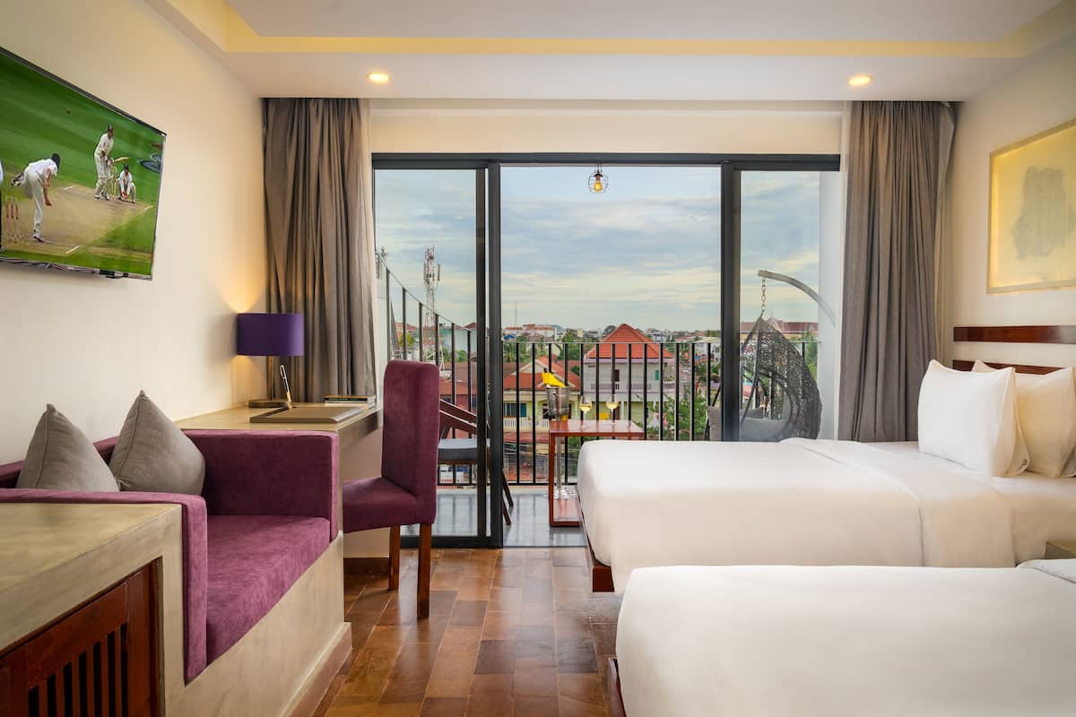 Deluxe Twin Pool View | Premium bedding, minibar, in-room safe, individually decorated