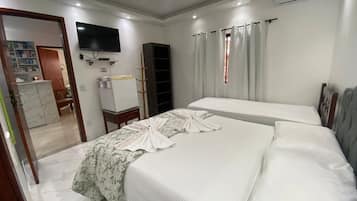 Basic Triple Room, 2 Bedrooms | Desk, blackout curtains, free WiFi, bed sheets