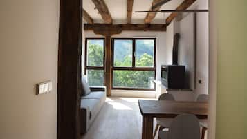 Apartment, 2 Bedrooms | Living area | TV, fireplace