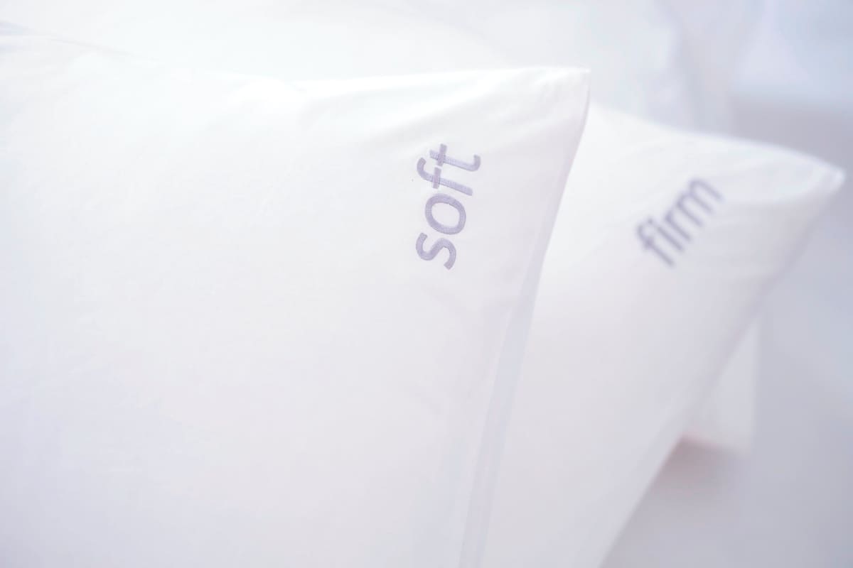 Pillows with the words "soft" and "firm" on them.