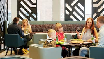 Enjoy casual or formal dining in this stylish space with individual booths and communal tables.
