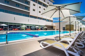 Outdoor pool, free pool cabanas, pool umbrellas
