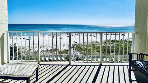 A balcony with a view of a beach and ocean. - SunSwept 505 by ALBVR (Orange Beach)
