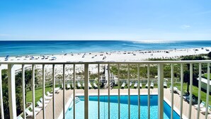 A poolside view with a clear view of the beach and ocean. - SunSwept 505 by ALBVR (Orange Beach)