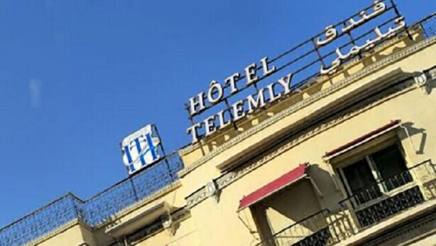 A hotel building with balconies and a sign that reads "HOTEL TELEMELY". - Telemly Hotel (Algiers)