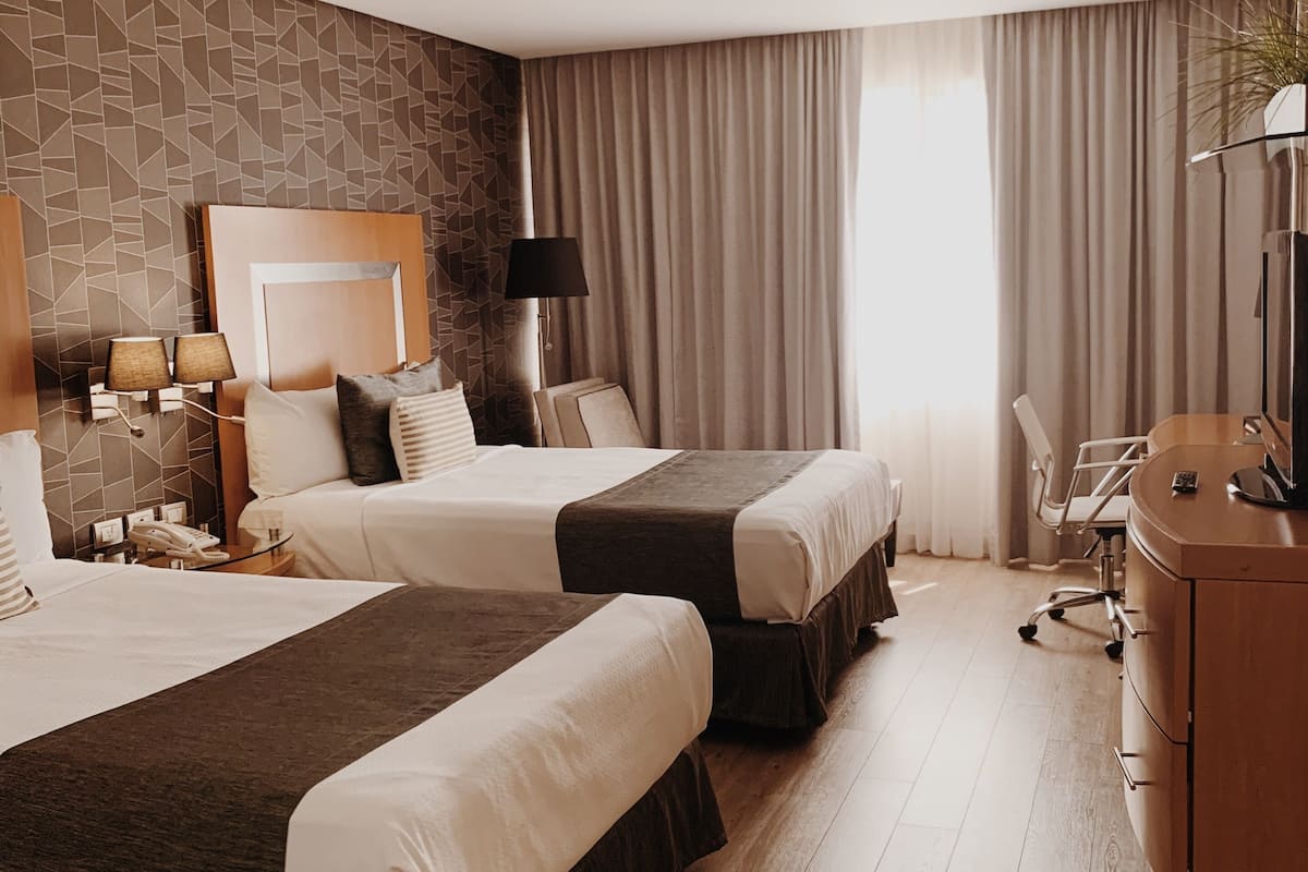 standard room, 2 double beds | in-room safe, desk, soundproofing, iron/ironing board