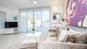 Deluxe Apartment, 2 Bedrooms | Living room | Flat-screen TV - Horizonte 34 by Playa Moments (Playa del Carmen)