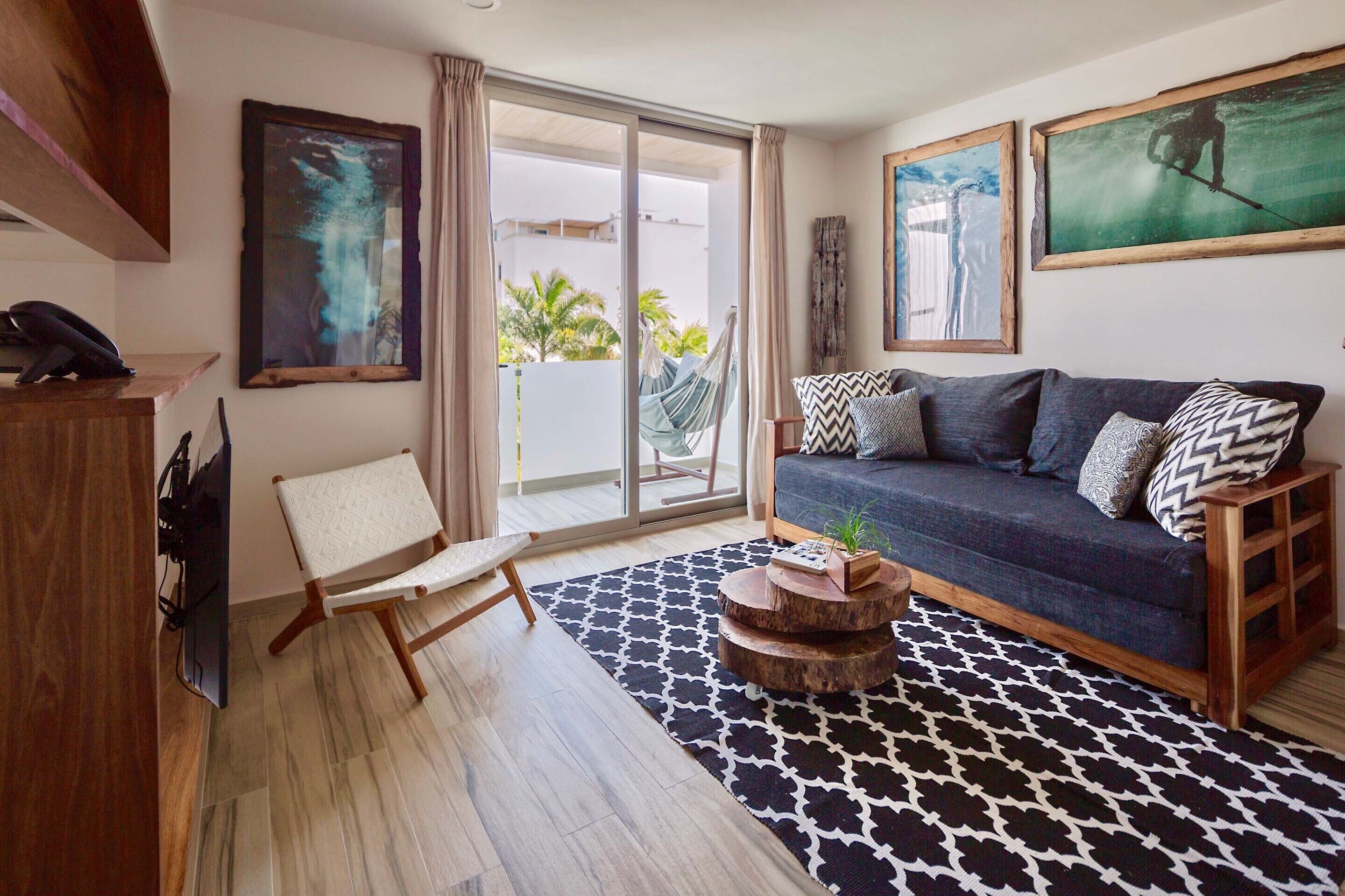 luxury apartment | living area | 50-inch flat-screen tv with cable channels, tv, ipod dock