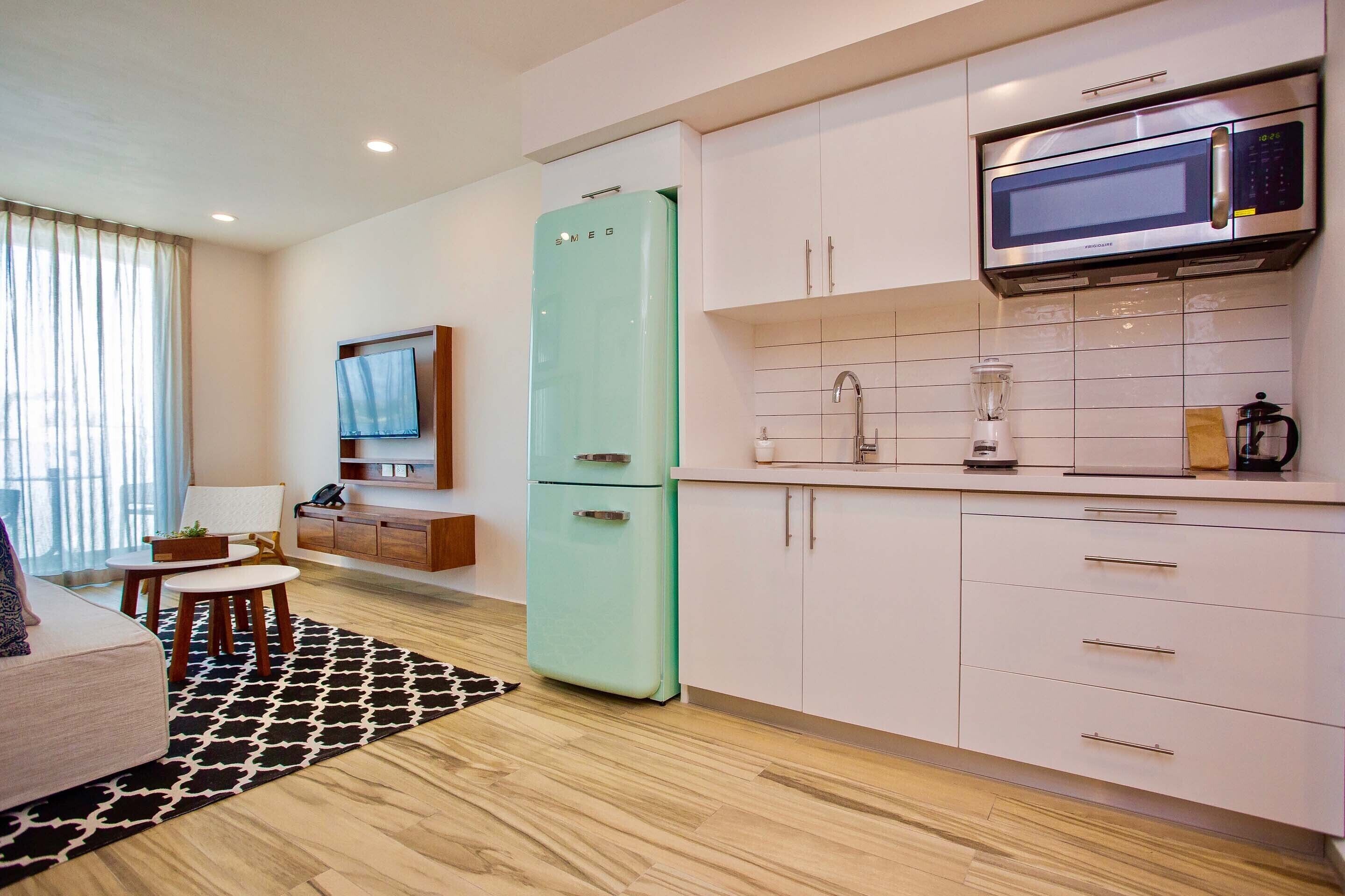 deluxe apartment | private kitchen | full-sized fridge, microwave, stovetop, coffee/tea maker