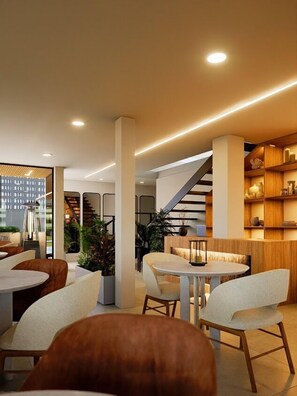 Un interior moderno con una escalera, zonas de estar y una recepción.