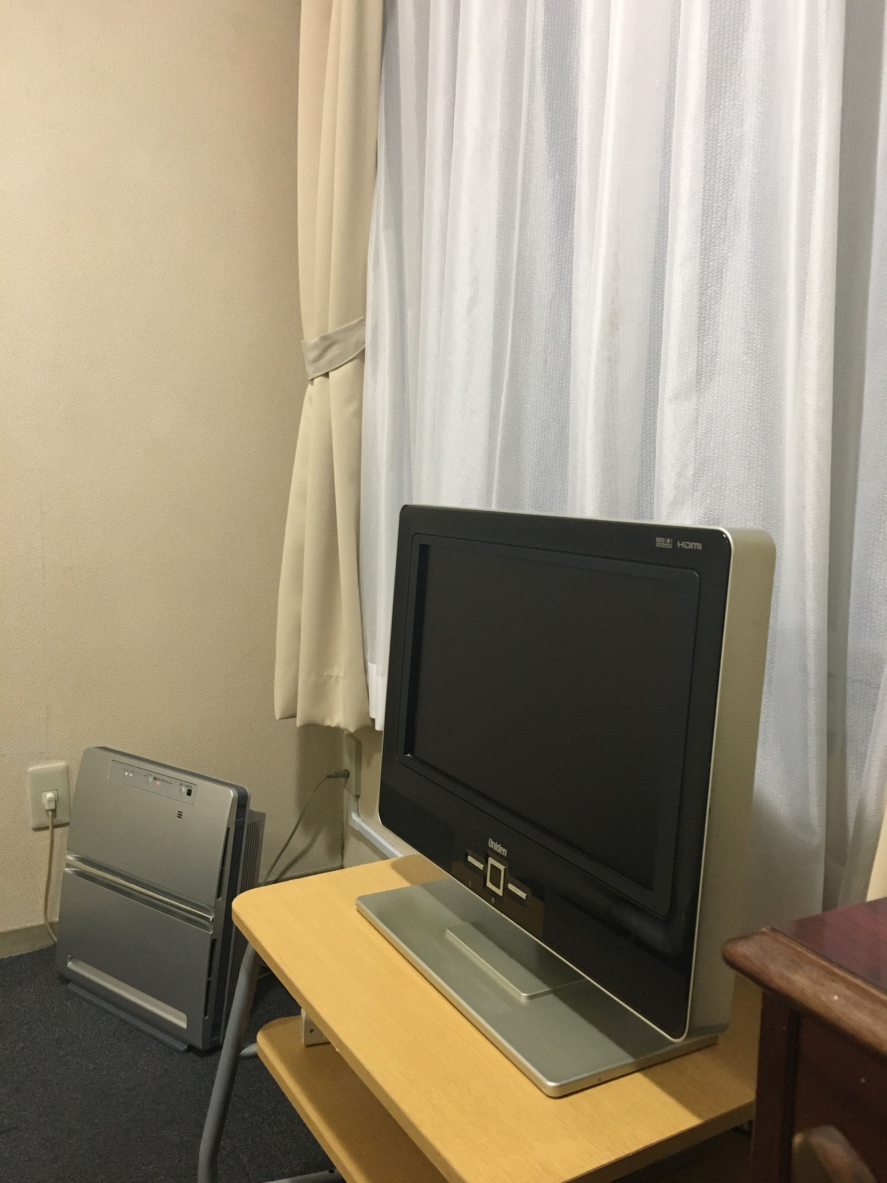 desk, laptop workspace, blackout curtains, iron/ironing board