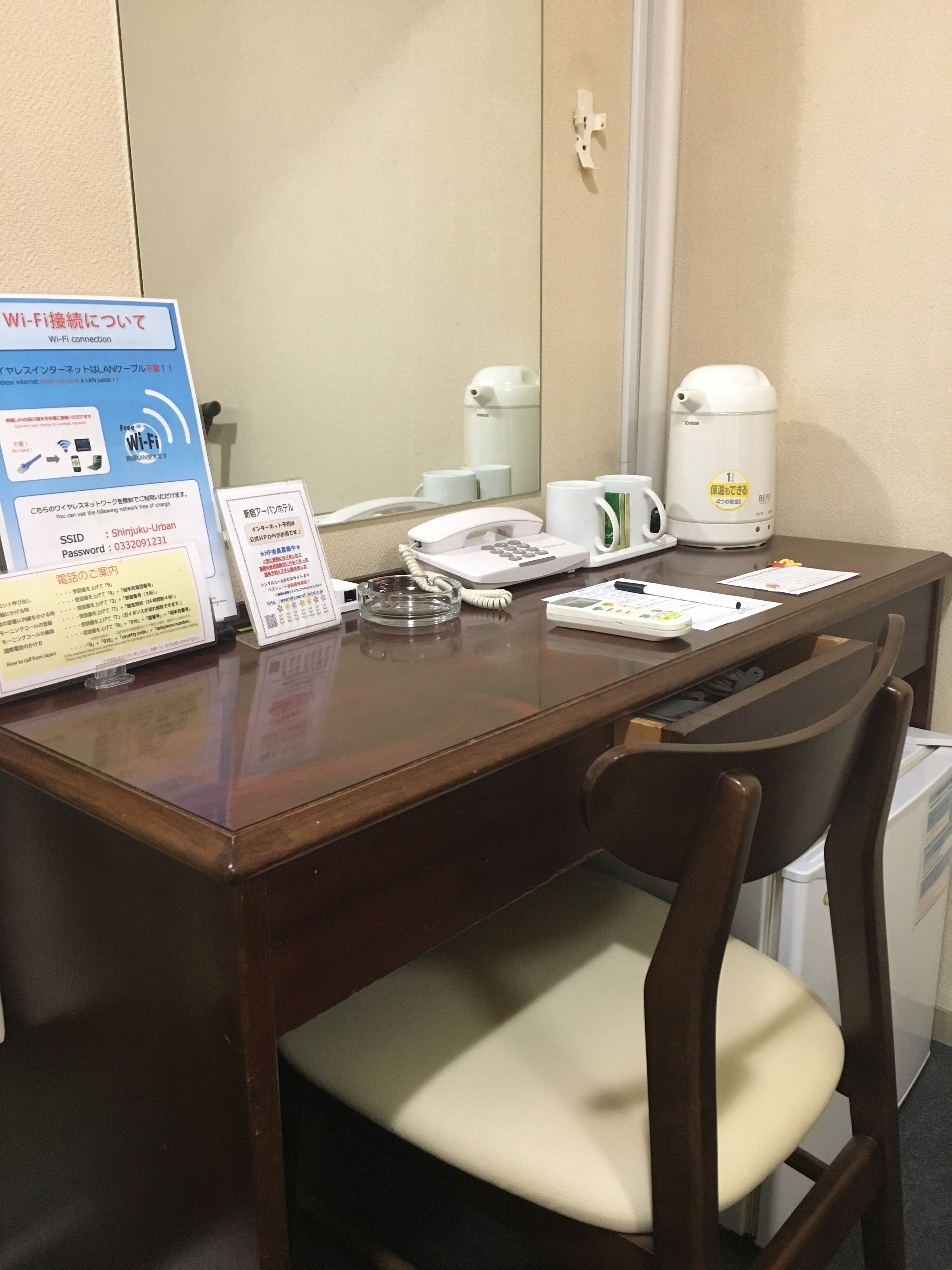 desk, laptop workspace, blackout curtains, iron/ironing board