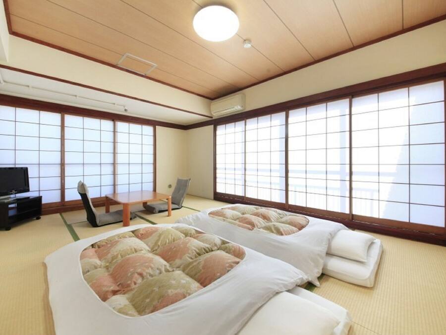 Desk, laptop workspace, blackout drapes, iron/ironing board