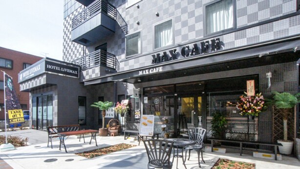 A building with a sign reading "Max Cafe" and a "Take Out Coffee" sign outside. - HOTEL LiVEMAX Minamihashimoto Ekimae (Sagamihara)