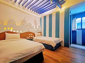 A hotel room with two beds, a wooden floor, a cityscape mural, and a window with curtains.
