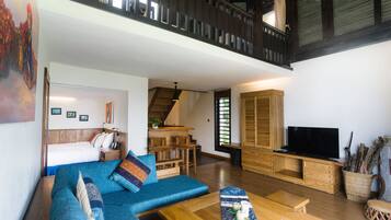 59-inch TV with cable channels, books