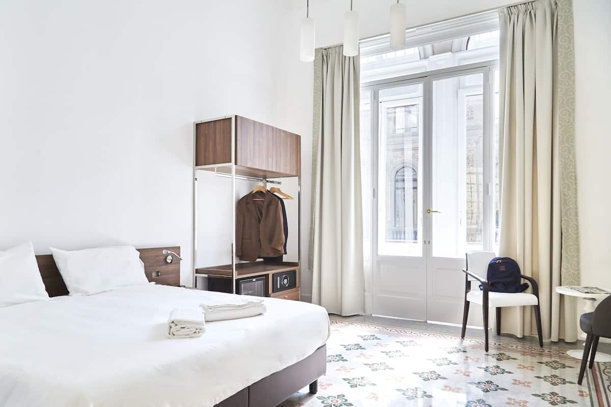 Superior kamer | Luxe beddengoed, een minibar, een kluis op de kamer