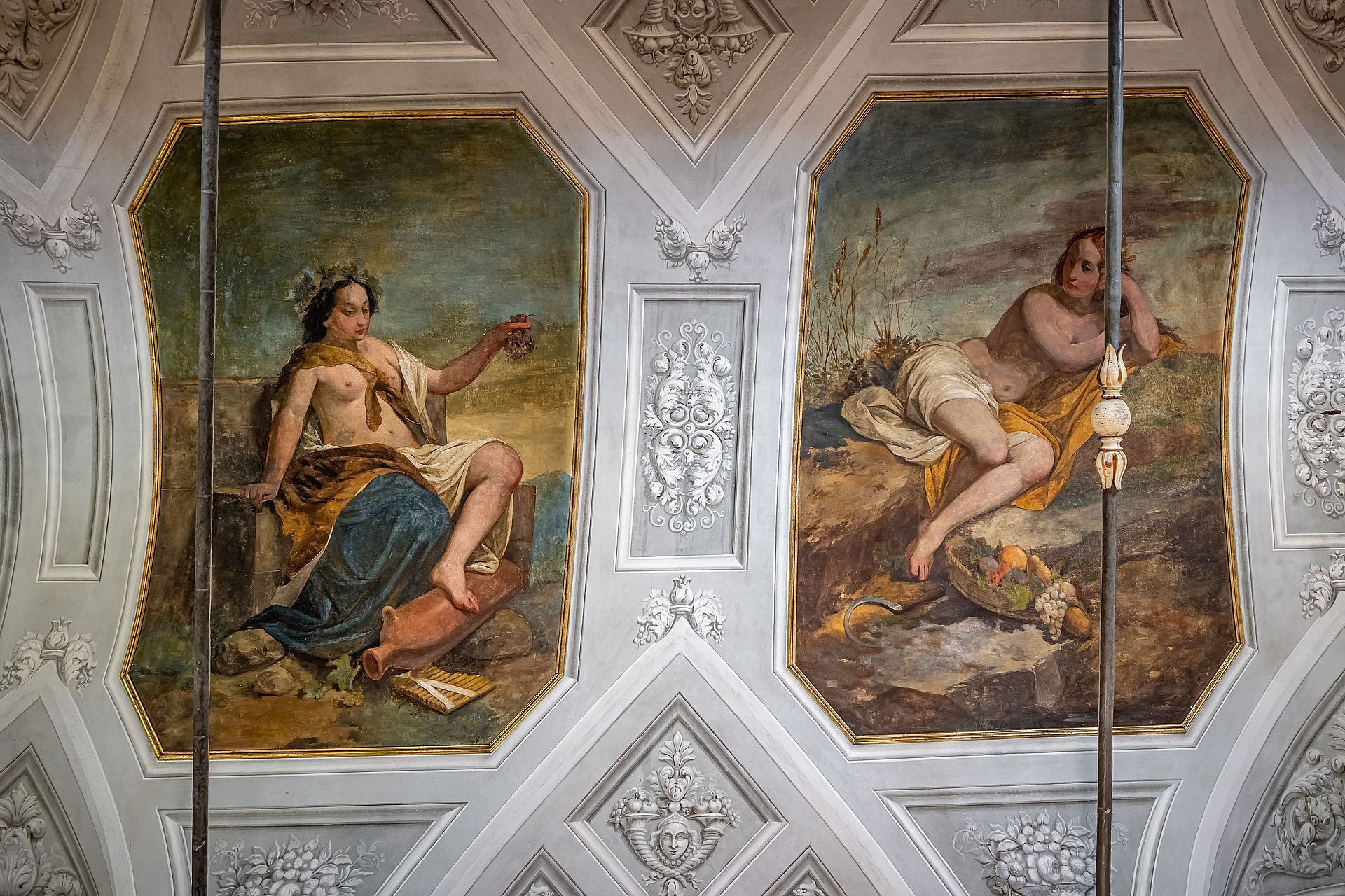 A ceiling with classical frescoes depicting mythological figures and intricate architectural details.