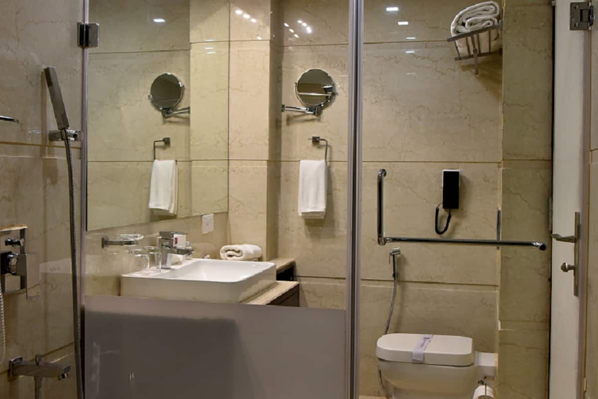 deluxe room | bathroom | shower, free toiletries, slippers, towels
