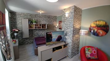 Exclusive Apartment, 1 Bedroom | Living room | 40-inch flat-screen TV with satellite channels, LED TV, Netflix