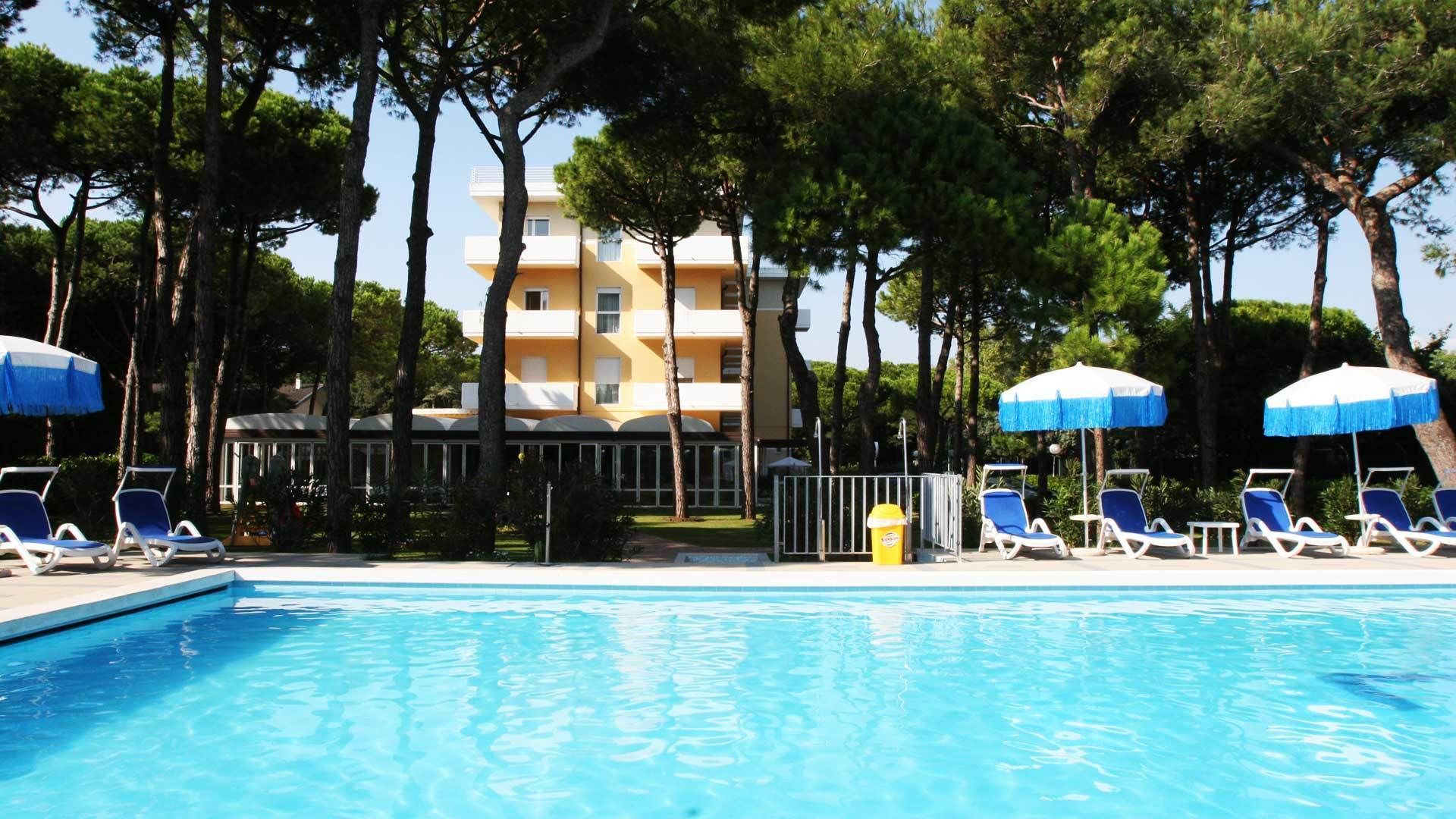 outdoor pool, open 8:30 am to 6:30 pm, pool umbrellas, pool loungers