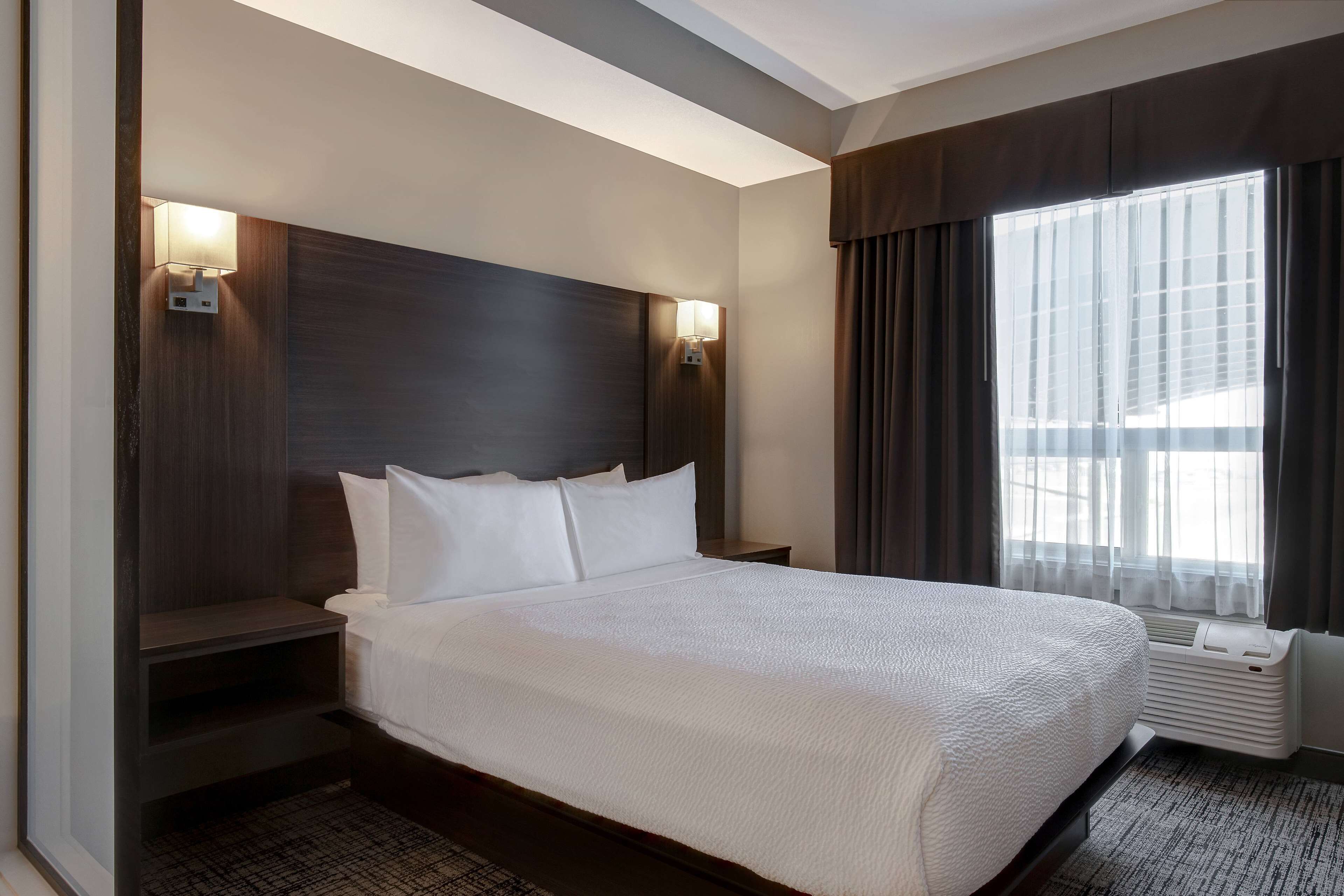 junior suite, 1 queen bed with sofa bed, non smoking | desk, laptop workspace, blackout curtains, iron/ironing board