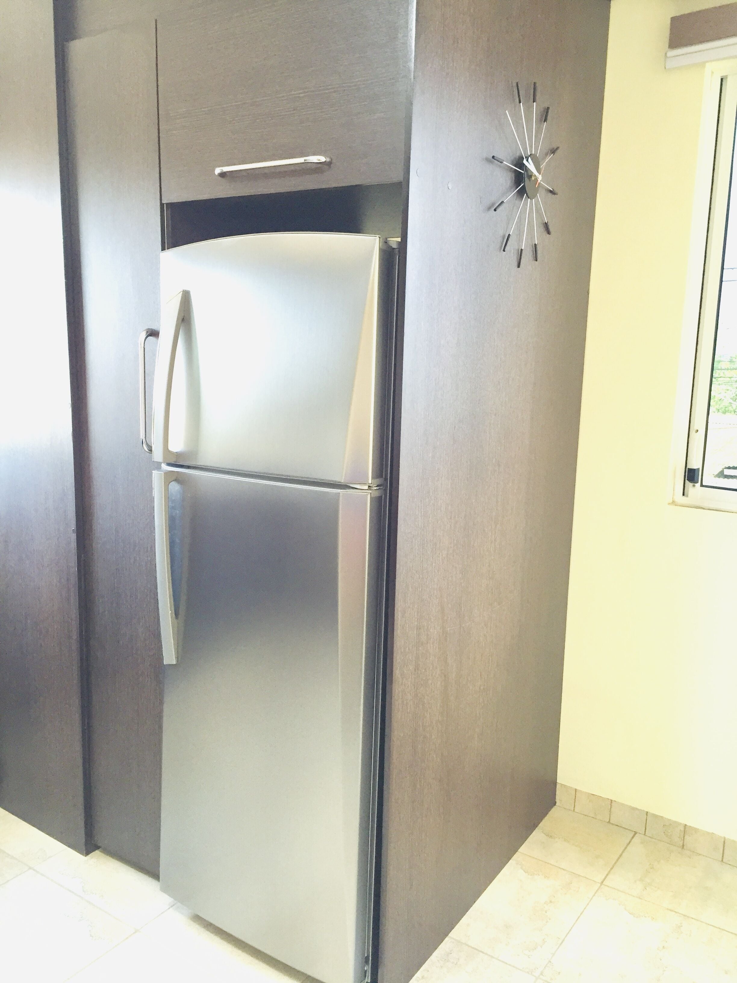 deluxe apartment, 1 king bed, kitchen, city view | private kitchen | fridge, microwave, high chair