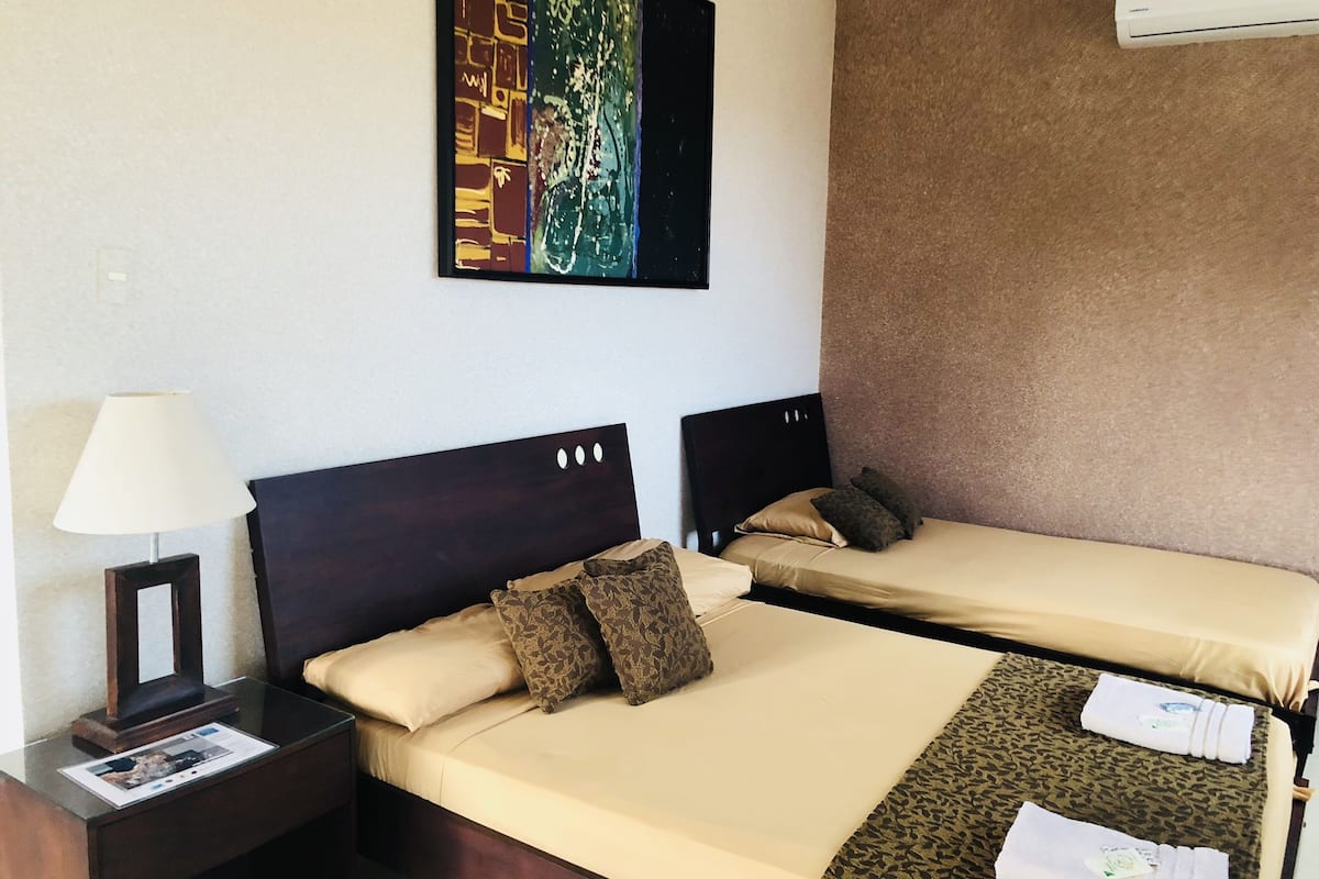standard triple room | in-room safe, individually decorated, desk, free wifi
