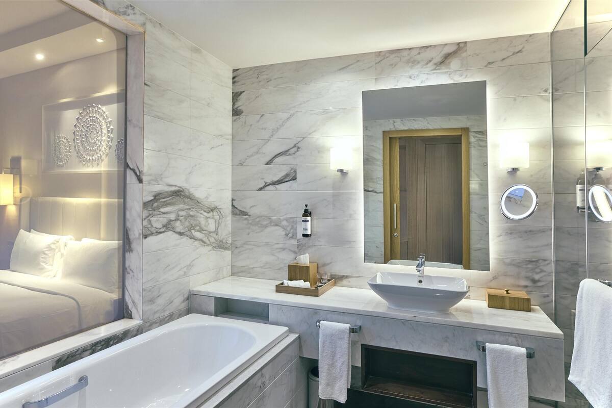 room, 1 king bed | bathroom | bathrobes, slippers, towels