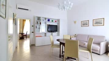 Apartment, 1 Bedroom | Living area | Flat-screen TV
