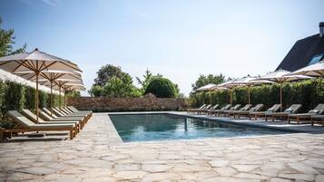 Seasonal outdoor pool, open 9:00 AM to 8:00 PM, pool umbrellas