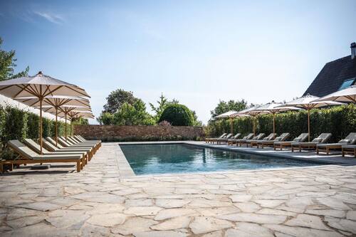 Seasonal outdoor pool, open 9:00 AM to 8:00 PM, pool umbrellas