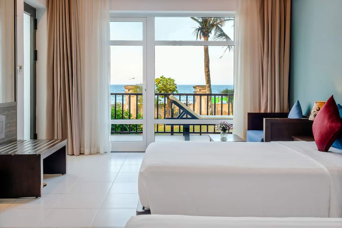 deluxe double or twin room, garden view | beach/ocean view
