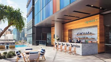 Outdoor pool, open 6 AM to 9 PM, pool loungers