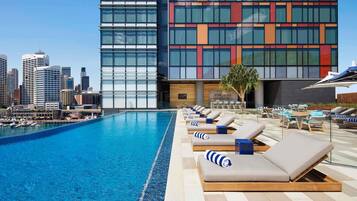 Outdoor pool, open 6 AM to 9 PM, pool loungers