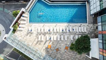 Outdoor pool, open 6 AM to 9 PM, pool loungers
