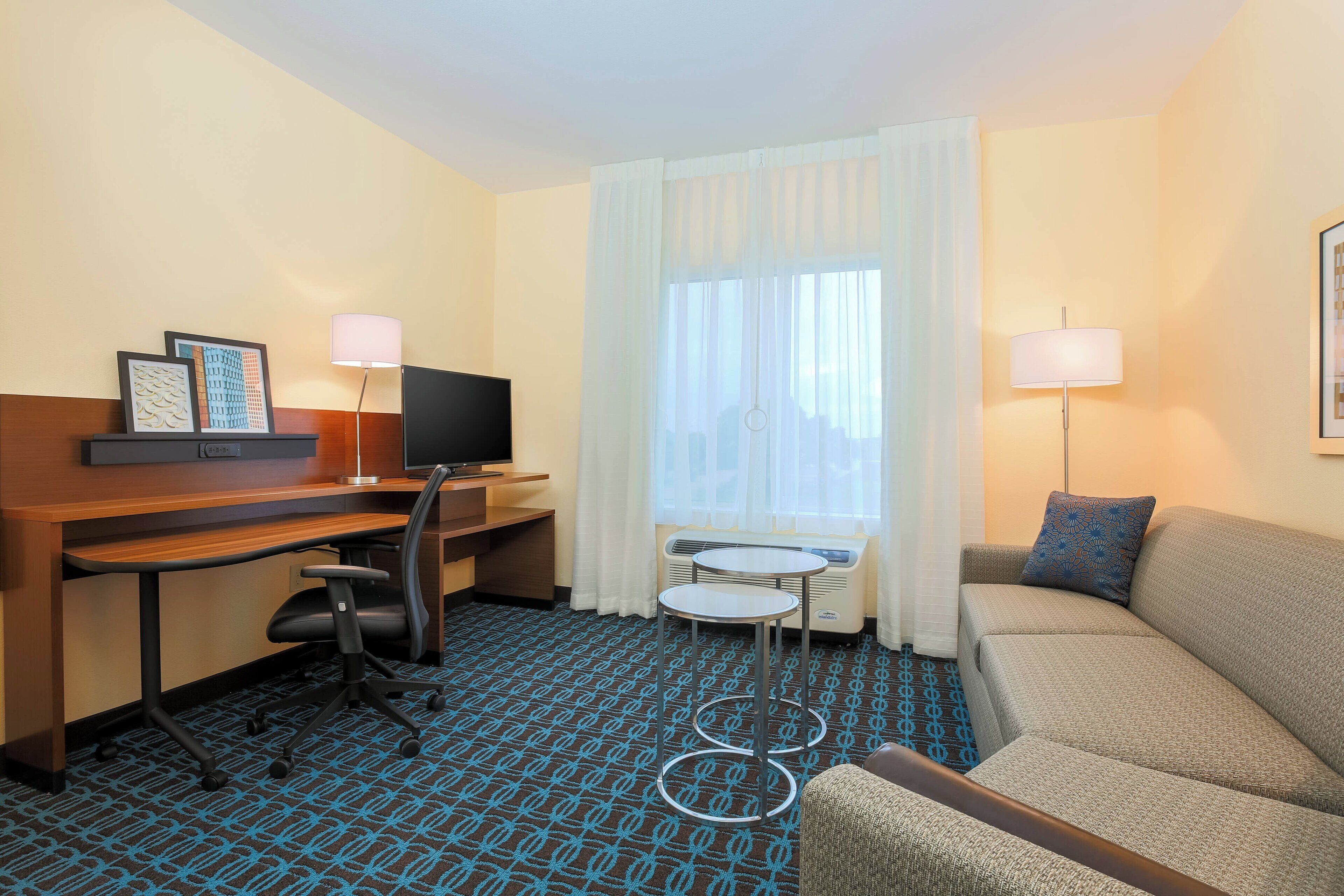 premium bedding, desk, laptop workspace, blackout curtains