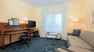 Premium bedding, desk, laptop workspace, blackout curtains