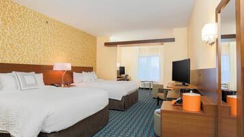 Premium bedding, desk, laptop workspace, blackout curtains