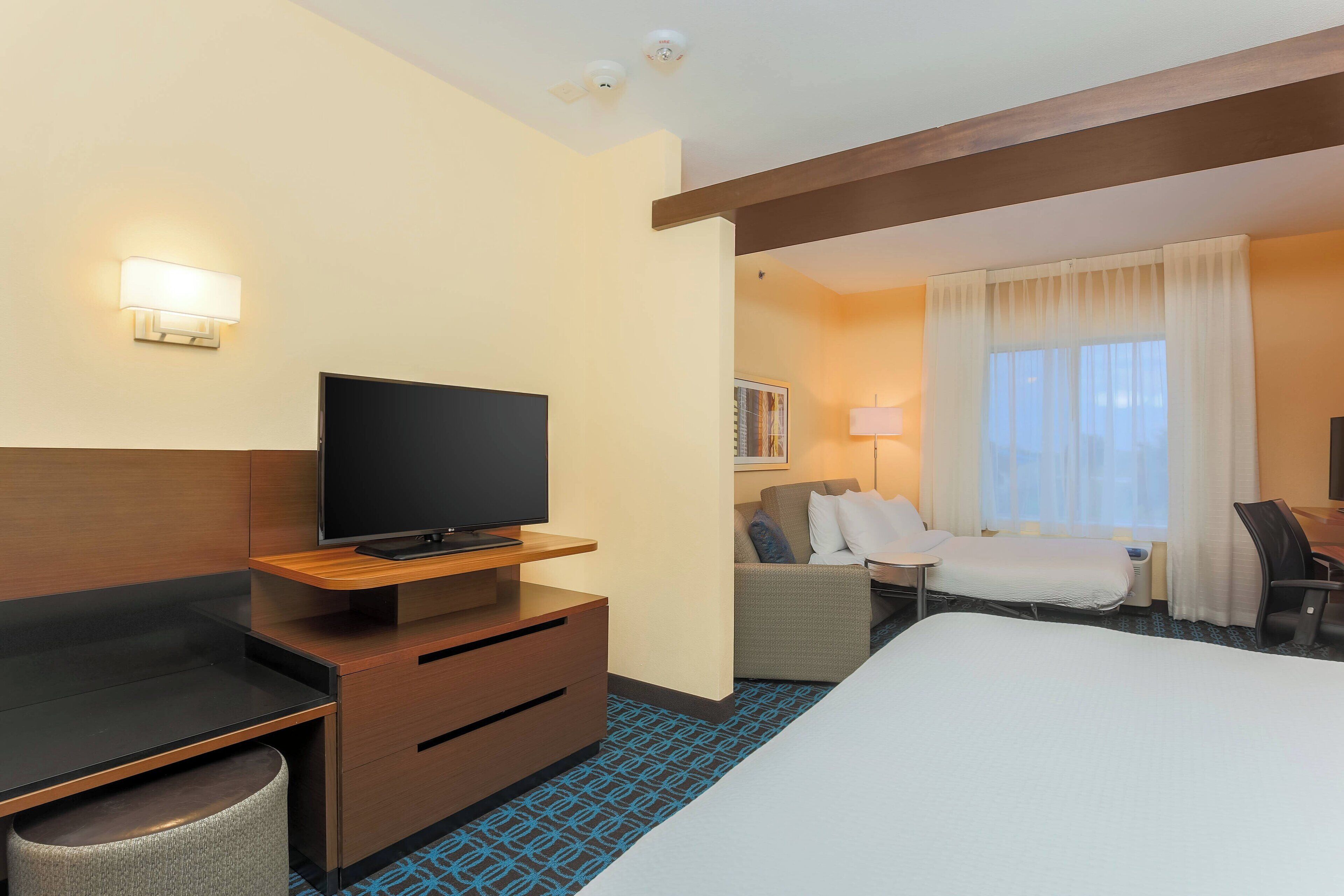 suite, 1 king bed with sofa bed, non smoking | premium bedding, desk, laptop workspace, blackout curtains