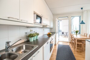Apartment, 2 Bedrooms | Private kitchen | Full-size fridge, microwave, oven, stovetop - Kotimaailma Apartments Vaasa (Vaasa)