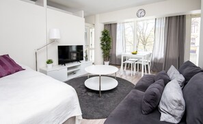 Family Apartment, 1 Bedroom | Living area | 40-inch flat-screen TV with cable channels, TV - Kotimaailma Apartments Vaasa (Vaasa)