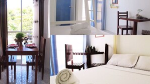 Une chambre d’hôtel avec un lit, un bureau, une chaise, une télévision et une fenêtre.