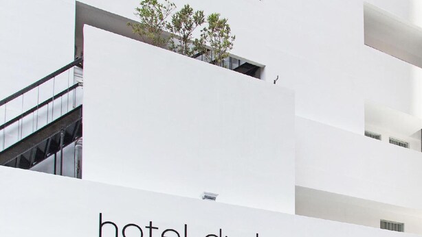 A modern hotel building with a prominent 'hotel durban' sign. - Hotel Durban (Makati)
