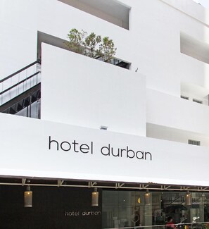 A modern hotel building with a prominent 'hotel durban' sign. - Hotel Durban (Makati)