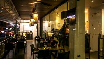 Enjoy a casual dining experience with a variety of seating options in this modern restaurant.