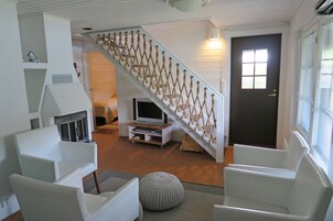 Family Villa, 4 Bedrooms, Sauna, Lake View | Living area | 55-inch flat-screen TV with cable channels, LED TV, fireplace