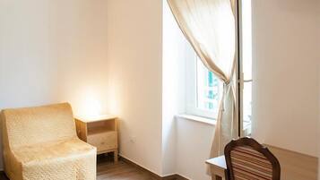 Deluxe Quadruple Room, City View | Room amenity