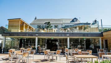 Enjoy a meal in our restaurant's spacious patio with a clear view of the interior.