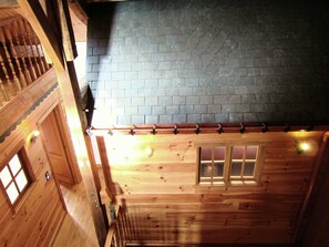 A wooden cabin with a sloped roof, a wooden staircase, and a brick wall. - Holiday home in Cul-des-Sarts near Forest (Cul des Sarts)